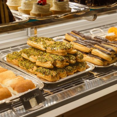 Eclairs and other sweets on showcase at cafe Eclairs and other sweets on showcase at cafe