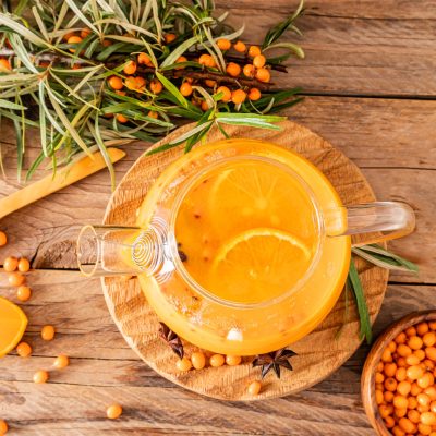 Hot vitamin Sea buckthorn tea into a glass teapot, drink Hot vitamin Sea buckthorn tea into a glass teapot, drink